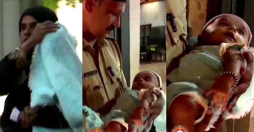 'സ്നേഹവാത്സല്യത്തിന്റെ കാക്കി' ; ചങ്കിൽ കയറി പോലീസ് മാമനും കുഞ്ഞാവയും!, Police officer, hold a baby, Manjeswaran election day, Kerala Police, Viral video, Social Post, Manorama Online